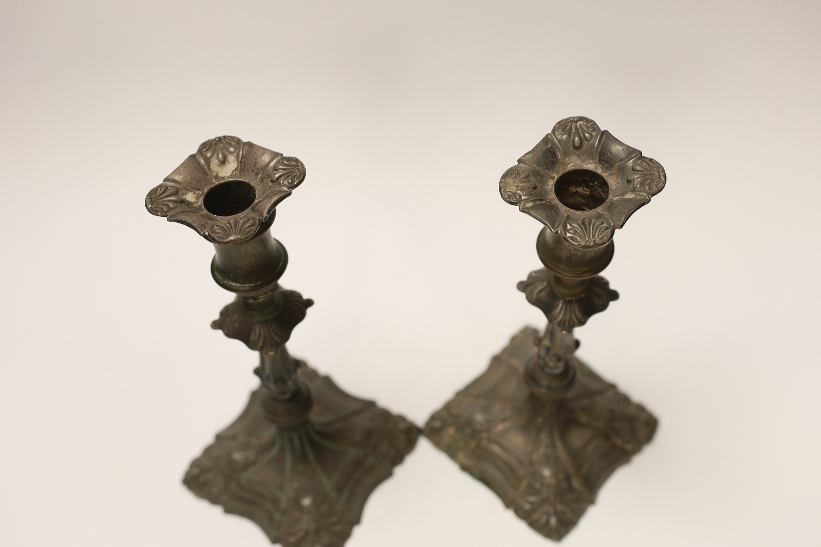 A pair of late 18th century Old Sheffield plate candlesticks, 24cm high